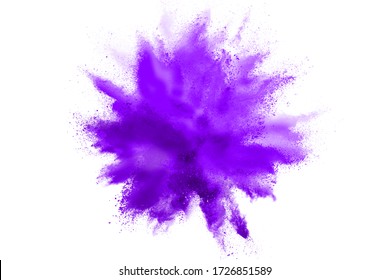 Freeze motion of purple color powder exploding on white background. 库存照片