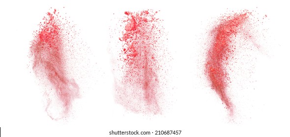 Freeze Motion Of Red Dust Explosion Isolated On White Background