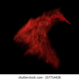 Freeze Motion Of Red Dust Explosion Isolated On Black Background