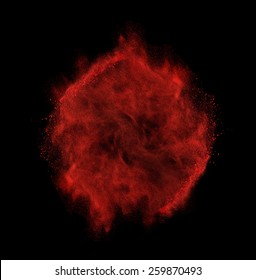 Freeze Motion Of Red Dust Explosion Isolated On Black Background