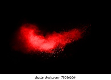 Freeze Motion Of Red Powder Exploding, Isolated On Black Background. Abstract Design Of Red Dust Cloud.