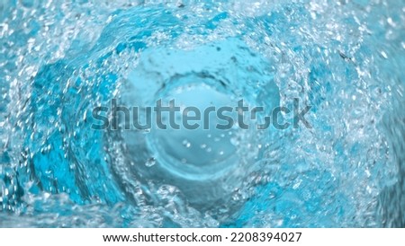 Freeze Motion Shot of Water Vortex Splash on Black Background at 1000fps.