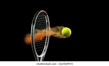 Freeze motion of tennis racket hitting the ball with colored powder explosion. Isolated on black background. - Powered by Shutterstock