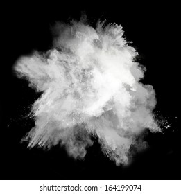 Freeze Motion Of White Dust Explosion Isolated On Black Background