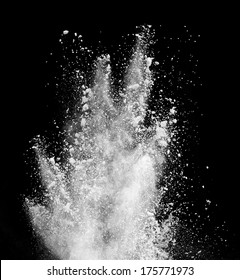 Freeze Motion Of White Dust Explosion Isolated On Black Background