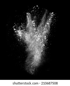 Freeze Motion Of White Dust Explosion Isolated On Black Background