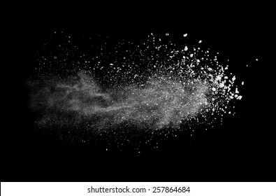 Freeze Motion Of White Dust Explosion Isolated On Black Background