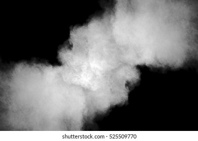 Freeze motion of white dust explosion on black background. Stopping the movement of white powder on dark background. Explosive powder white on black background. - Shutterstock ID 525509770