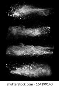 Freeze Motion Of White Dust Explosions Isolated On Black Background