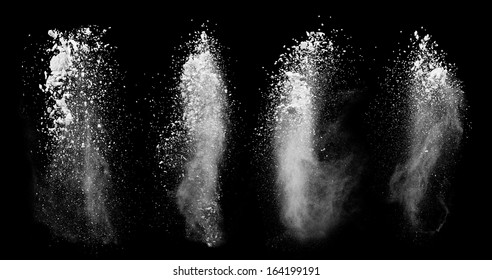 Freeze Motion Of White Dust Explosions Isolated On Black Background