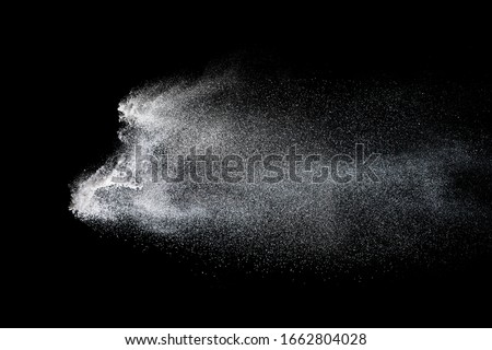 Freeze motion of white dust explosion.Stopping the movement of white powder. 