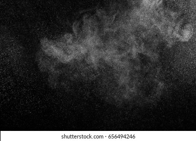 Freeze Motion Of White Particles On Black Background. Powder Explosion. Abstract Dust Overlay Texture.