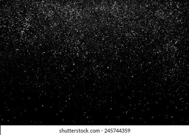 Freeze motion of white powder coming down, isolated on black, dark background. Abstract design of falling dust cloud. Particles cloud screen saver, wallpaper with copy space. Rain, snow fall concept - Shutterstock ID 245744359