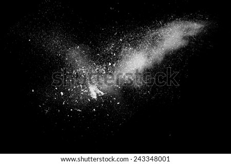 Freeze motion of white powder exploding, isolated on black, dark background. Abstract design of white dust cloud. Particles explosion screen saver, wallpaper with copy space. Planet creation concept 