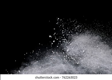 Freeze Motion Of White Powder Explosions Isolated On Black Background.