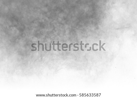 Freeze movement, black powder explosion isolated on white, white background. Abstract design of black smoke. Screen saver explosive particles wallpaper with copy space. Concept creation Planet