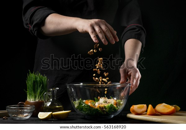 Freezer food prepare in process vegetarian
salad by chef hand in home kitchen. Dark black background with Text
area for design menu
restaurant