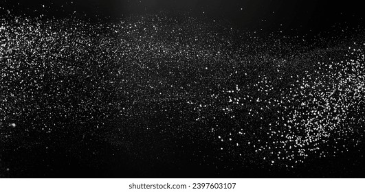 Freezing falling particles or stardust in air on black background for overlay blending mode. Stopping the movement of white powder on a dark background, selective focus, wide banner