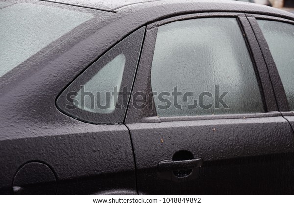Freezing\
rain ice coated car,side window and rear\
window