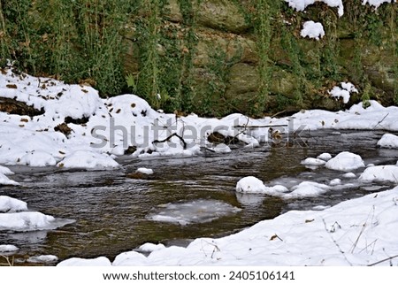 freezing river in winter ice, white snow.