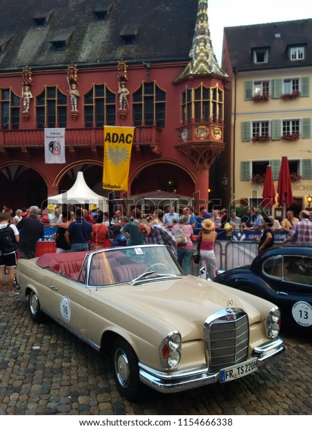 FREIBURG, GERMANY - AUGUST 3, 2018: A 1961\
Mercedes-Benz 220 SE Cabriolet is parked after finishing at the\
Schauinsland Klassik 2018 classic car\
rally.