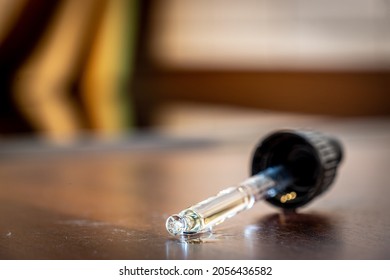 FREIBURG, GERMANY - OCTOBER 12, 2021: Pipette Full Of Oil With Vitamin D And Vitamin K2