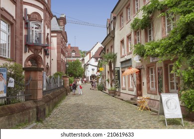 FREIBURG IM BREISGAU, GERMANY - AUGUST 6, 2014: Old town street in Freiburg, a city in the south-western part of Germany in the Baden-Wurttemberg state.