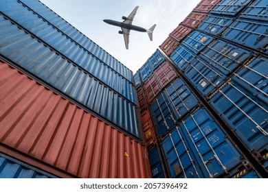 Freight Airplane Flying Above Overseas Shipping Container . Logistics Supply Chain Management And International Goods Export Concept .