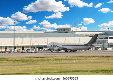 Freight Plane In Cargo Terminal At Airport