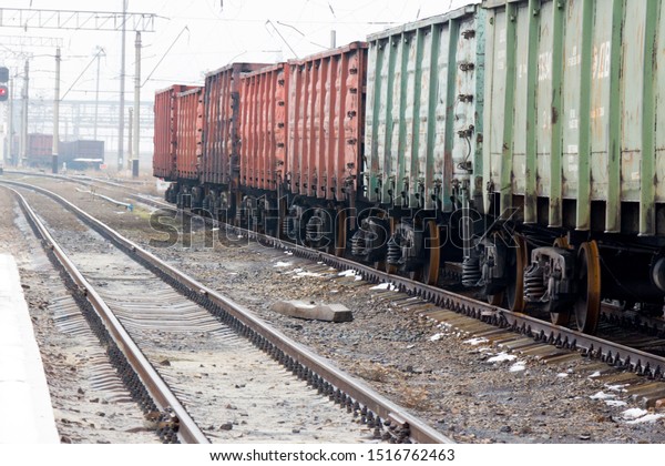 Freight\
railroad cars are in the industrial\
zone.