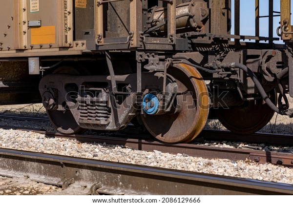 Freight train cars on railroad\
tracks. Supply chain, rail transportation and shipping\
concept