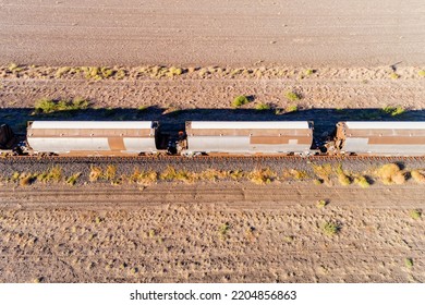 Freight Train Cycterns At Grain Salo Storage Warehouse In Moree Rural Town Of Australian Artesian Basin - Aerial Top Down View.