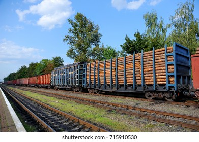 Freight train loaded with pine trunks