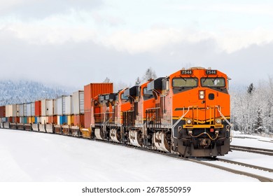 freight train pulling cargo in winter close to Whitefish, Montana