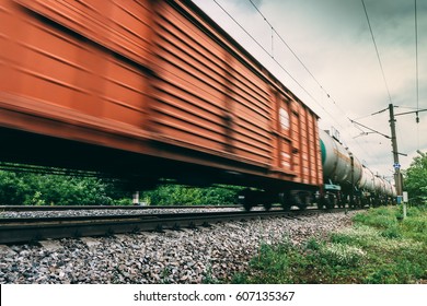 Freight train, railway wagons with motion blur effect. Transportation, railroad, toned image - Powered by Shutterstock