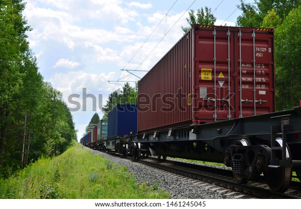 Freight train,\
transportation of railway cars by cargo containers shipping.\
Railway logistics concept -\
Image