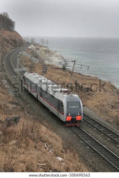 freight train traveling in a mountainous area in\
Siberia (Russia)
