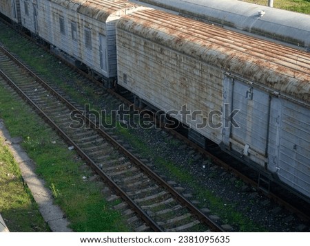 Freight trains. The concept of cargo transportation by rail. Cars for loading. Railway station