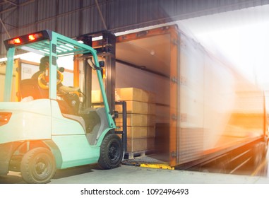 Freight transportation and Logistic warehouse, Forklift driver loading the shipment pallet into a truck container. - Shutterstock ID 1092496493
