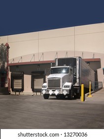 Freight Truck At Loading Bay With Copy Space