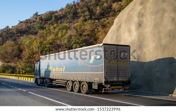 Freight truck on a beautiful mountain road. The\
truck belongs to the transport company L. Pfahnl. Location:\
Romania, Orsova. October, 20,\
2019.