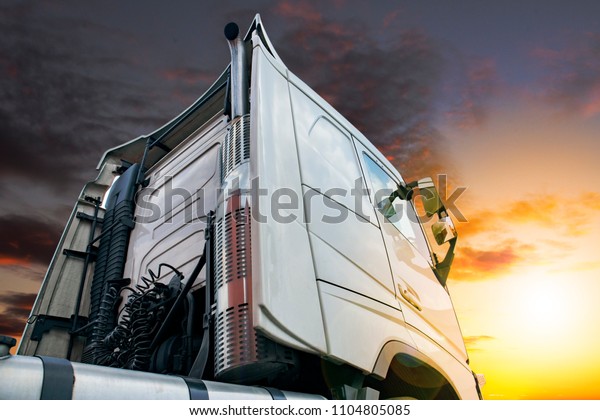 Freight Truck\
transportation at\
sunset.