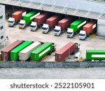 Freight trucks at warehouse loading dock. Industry logistics and distribution center. Logistics delivery and transportation. Supply chain. Shipping and cargo management. Industrial logistics hub.