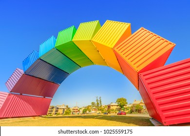 Fremantle, Australia - Jan 7, 2018: Fremantle travel welcome. Rainbow Sea Container in Fremantle Port near Perth, Western Australia. Homosexuality and hope concept. Blue sky. Copy space.