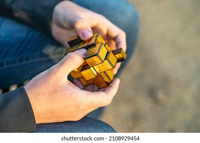 Fremont, CA, USA - January 15, 2022: A Man Solving A Mirror Rubik's Cube.