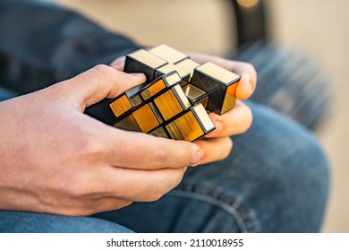 Fremont, CA, USA - January 15, 2022: A Man Solving A Mirror Rubik's Cube.