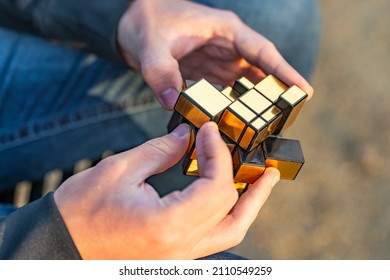 Fremont, CA, USA - January 15, 2022: A Man Solving A Mirror Rubik's Cube.