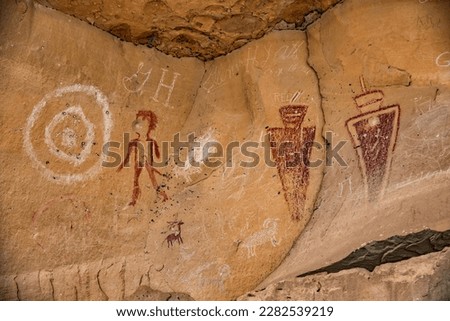 Fremont culture petroglyphs and pictographs intermingle with newer etchings from pioneer settlers on the walls of Sego Canyon, located near Moab, Utah, United States.