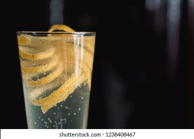 French 75 Alcoholic Cocktail Garnish With A Long Ribbon Of Lemon Peel