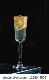 French 75 Alcoholic Cocktail Garnish With A Long Ribbon Of Lemon Peel